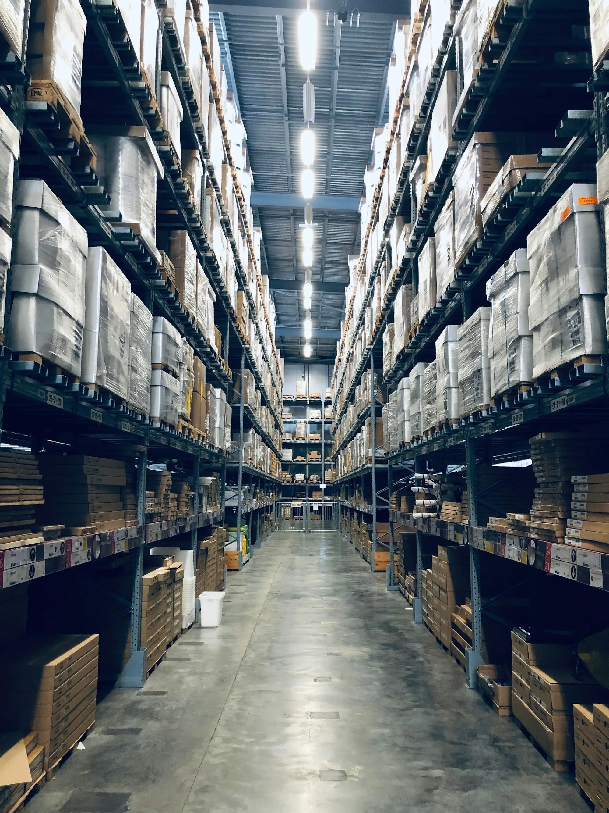 Warehouse aisles with pallets of packaged goods